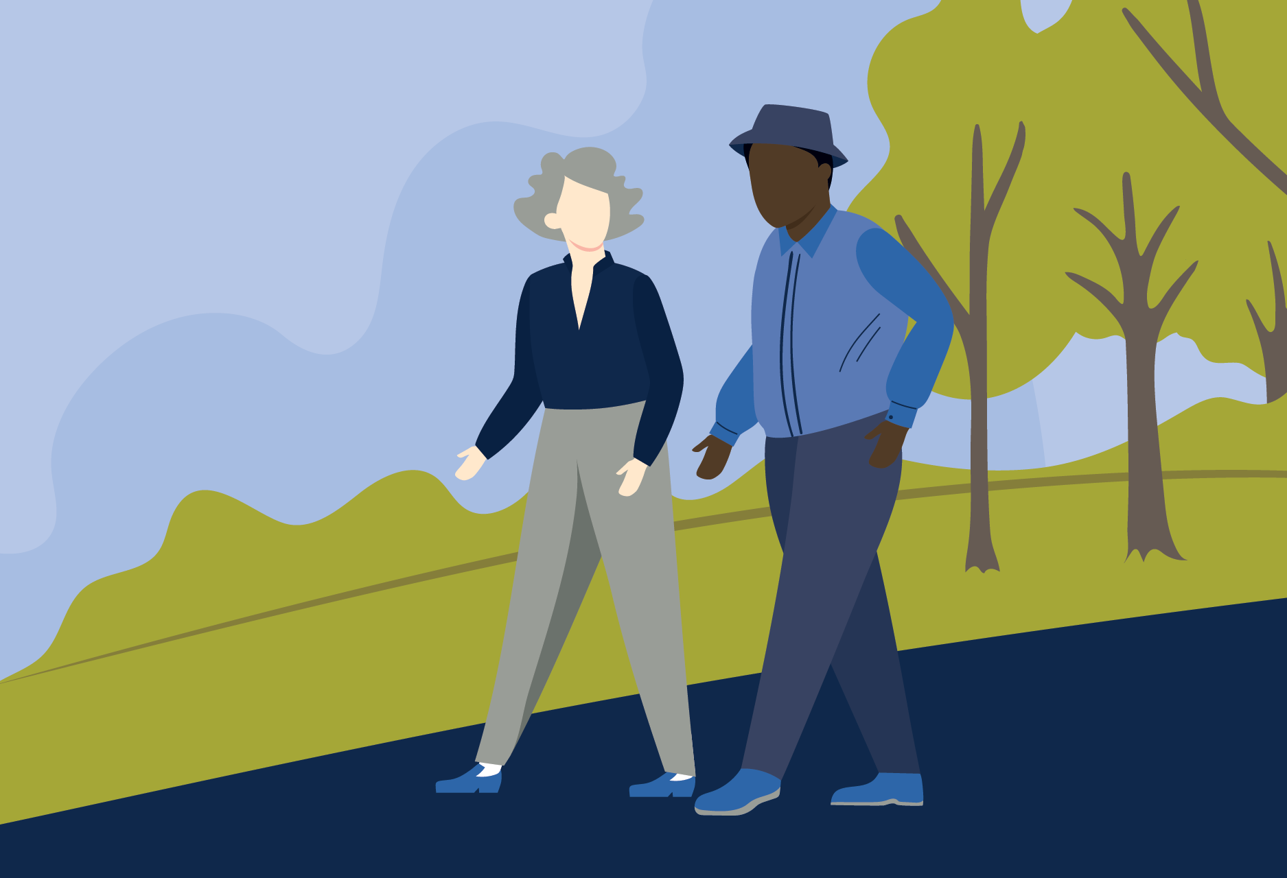 two people walking in a park